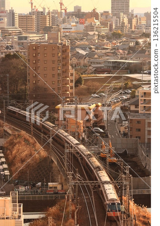 Odakyu 30000 series Romancecar express train running through the streets of Machida, Tokyo. Photo taken on January 27, 2011. Odakyu 30000 series Romancecar express train running through the streets of Machida, Tokyo. Photo taken on January 27, 2011. 136215504
