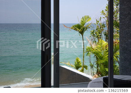 View from luxury villa at sunny day, sun loungers for sunbathing, umbrellas from the sun, pillows for swimming in the pool, palm tree on background View from luxury villa at sunny day, sun loungers for sunbathing, umbrellas from the sun, pillows for swimming in the pool, palm tree on background 136215569