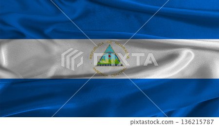 Flag of Nicaragua with fabric textured background. Close up of National flag of Nicaragua with realistic texture 136215787