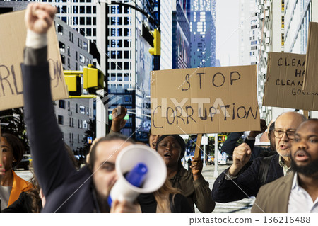 Public demonstration shows people united in activism against corruption, law misconduct and censorship, demanding democracy and equal rights. Non-violent protest and political action. Public demonstration shows people united in activism against corruption, law misconduct and censorship, demanding democracy and equal rights. Non-violent protest and political action. 136216488