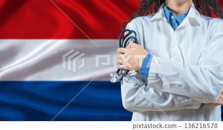 Healthcare professional with Netherlands flag background. Professional doctor holding stethoscope on Netherlands flag background 136216578