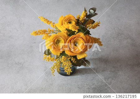 Mimosa and ranunculus 136217195