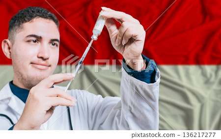 Doctor holding syringe on Indonesia flag background. Medical professional holding syringe with Indonesian flag in the background Doctor holding syringe on Indonesia flag background. Medical professional holding syringe with Indonesian flag in the background 136217277