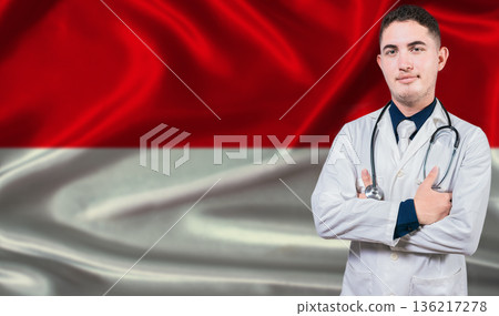 Portrait of medical professional on Indonesia flag background. Indonesian national health system 136217278