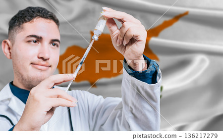 Doctor holding syringe on Cyprus flag background. Medical professional holding syringe with Cyprus flag in the background Doctor holding syringe on Cyprus flag background. Medical professional holding syringe with Cyprus flag in the background 136217279