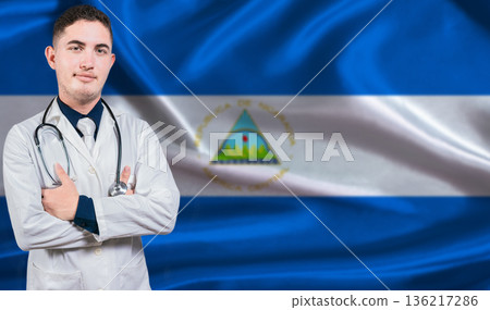 Portrait of medical professional on Nicaragua flag background. Nicaraguan national health system Portrait of medical professional on Nicaragua flag background. Nicaraguan national health system 136217286