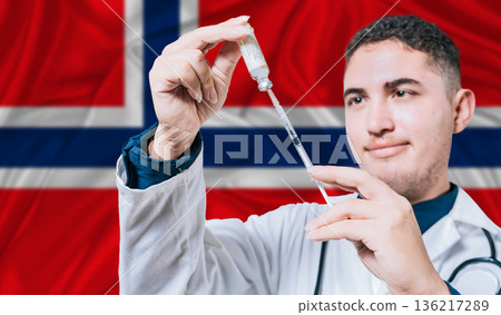Doctor holding syringe on Norway flag background. Medical professional holding syringe with Norwegian flag in the background Doctor holding syringe on Norway flag background. Medical professional holding syringe with Norwegian flag in the background 136217289