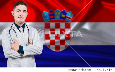 Portrait of medical professional on Croatia flag background. Croatian national health system Portrait of medical professional on Croatia flag background. Croatian national health system 136217316