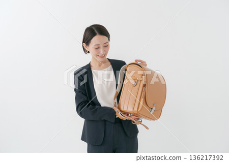 Mother with school bag Mother with school bag 136217392
