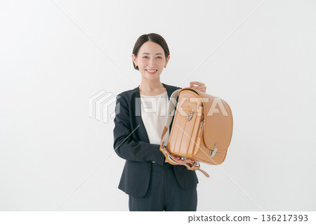 Mother with school bag Mother with school bag 136217393