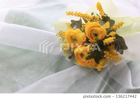 Mimosa and ranunculus bouquet Mimosa and ranunculus bouquet 136217442