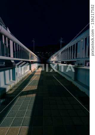 Pedestrian bridge at night, linear composition, vertical composition Pedestrian bridge at night, linear composition, vertical composition 136217582