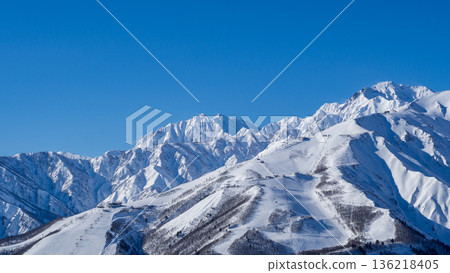 Snowy landscapes and mountain scenery of the Northern Alps shining under a clear blue sky Snowy landscapes and mountain scenery of the Northern Alps shining under a clear blue sky 136218405