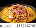 Neapolitan pasta cooked on an iron plate 136218749