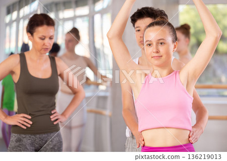 Teenage boy and girl rehearsing paired ballet 136219013