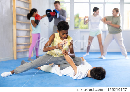 Group self defense training - boys learn how to apply painful techniques 136219157