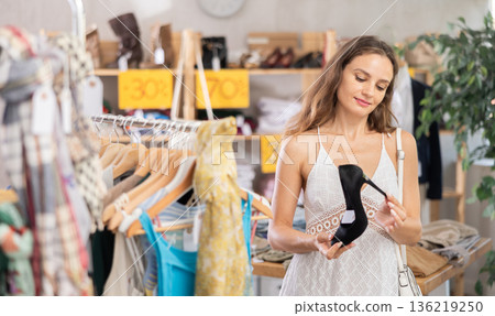 Woman choosing shoes in the store 136219250