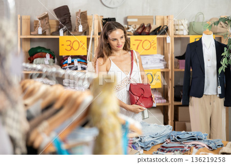 Woman buying bag on sale Woman buying bag on sale 136219258