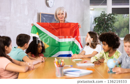 students listen to woman teacher who talks about South Africa students listen to woman teacher who talks about South Africa 136219333