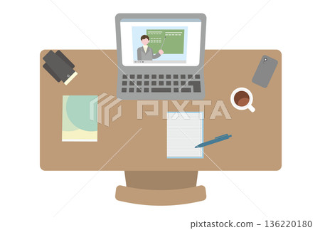 A desk with a computer with an online class video open 136220180