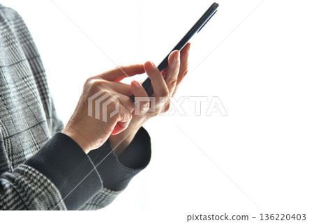 Senior woman operating mobile phone Senior woman operating mobile phone 136220403