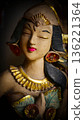serene Bali dancer ceramic bust featuring closed eyes, bright lips, and gold embellishments. Ideal decorative sculpture for home, temple, or gallery displays, emphasizing art, culture, and craft 136221364