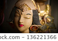 serene Bali dancer ceramic bust featuring closed eyes, bright lips, and gold embellishments. Ideal decorative sculpture for home, temple, or gallery displays, emphasizing art, culture, and craft 136221366