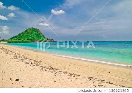 Beautiful view of white sand beach on tropical island, Mandalika beach, Lombok, Indonesia Beautiful view of white sand beach on tropical island, Mandalika beach, Lombok, Indonesia 136221855