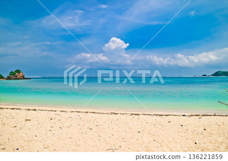 Beautiful view of white sand beach on tropical island, Mandalika beach, Lombok, Indonesia Beautiful view of white sand beach on tropical island, Mandalika beach, Lombok, Indonesia 136221859