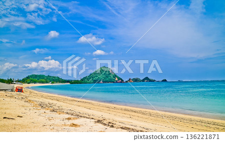 Beautiful view of white sand beach on tropical island, Mandalika beach, Lombok, Indonesia Beautiful view of white sand beach on tropical island, Mandalika beach, Lombok, Indonesia 136221871