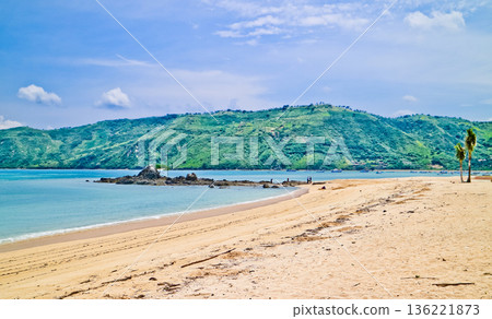 Beautiful view of white sand beach on tropical island, Mandalika beach, Lombok, Indonesia Beautiful view of white sand beach on tropical island, Mandalika beach, Lombok, Indonesia 136221873