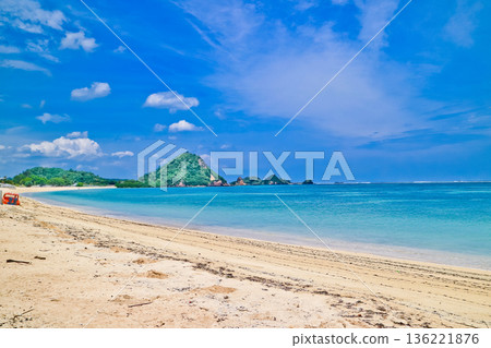 Beautiful view of white sand beach on tropical island, Mandalika beach, Lombok, Indonesia Beautiful view of white sand beach on tropical island, Mandalika beach, Lombok, Indonesia 136221876
