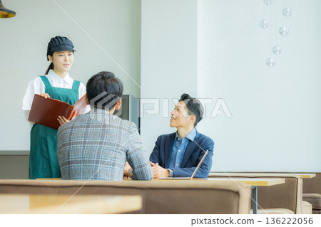 Staff taking orders at a cafe Staff taking orders at a cafe 136222056