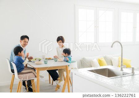 Family eating at the dining table Family eating at the dining table 136222761