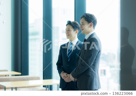 Business people standing and talking 136223066