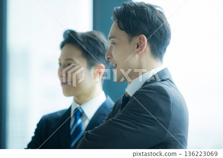 Business people standing and talking Business people standing and talking 136223069