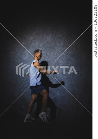 A man stretching 136223108