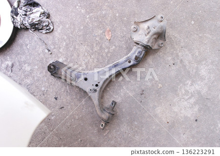 Car Suspension Lower Control Arm, An old, used Car Suspension Lower Control Arm, An old, used 136223291