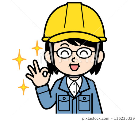 A middle-aged woman on a construction site wearing a helmet who says OK A middle-aged woman on a construction site wearing a helmet who says OK 136223329