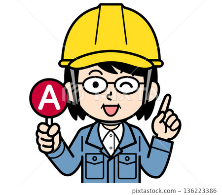 A middle-aged woman on a construction site wearing a helmet holding an A tag 136223386