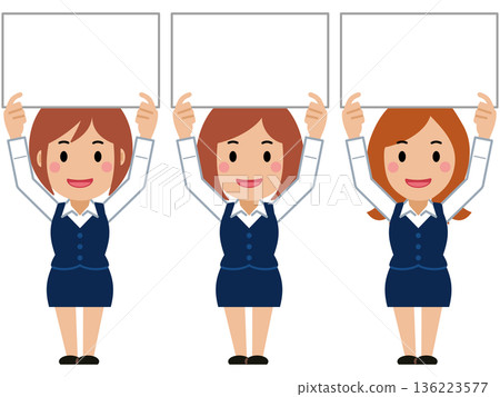 A young woman in navy office wear holding up a board 136223577