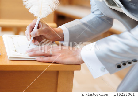 bride and groom signing the contract bride and groom signing the contract 136225001