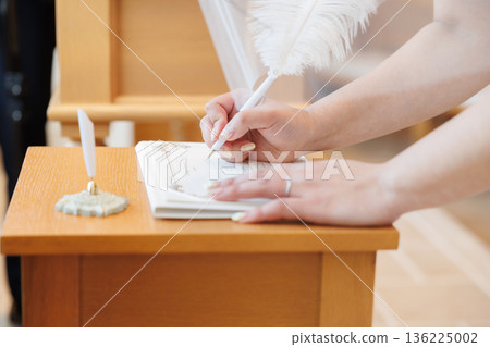 bride and groom signing the contract bride and groom signing the contract 136225002