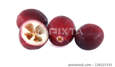 Fresh whole and halved cranberries isolated on a clean white background for culinary use Fresh whole and halved cranberries isolated on a clean white background for culinary use 136225335