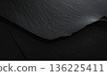 Black textured minimalist background featuring sharp edges and overlapping layers 136225411