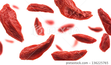 Dry Goji berries levitate on a white background Dry Goji berries levitate on a white background 136225765