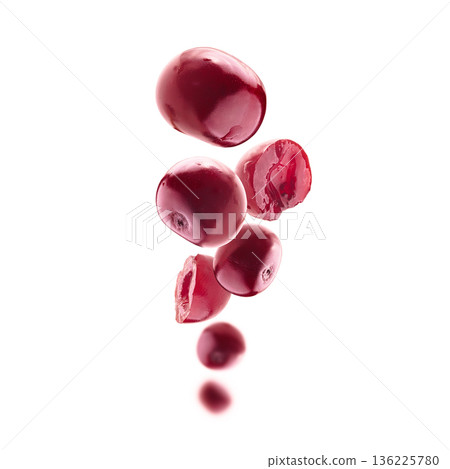 Red cherry berries levitate on a white background Red cherry berries levitate on a white background 136225780