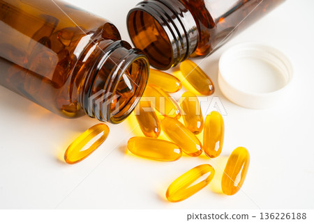 Fish oil Omega 3 capsules vitamin with EPA and DHA isolated on white background. Fish oil Omega 3 capsules vitamin with EPA and DHA isolated on white background. 136226188
