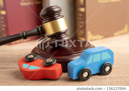 Car accident lawsuit and insurance, Judge hammer with car model. Car accident lawsuit and insurance, Judge hammer with car model. 136227004