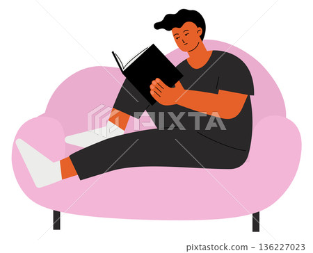 Young man read on sofa. Leisure evening hobby Young man read on sofa. Leisure evening hobby 136227023